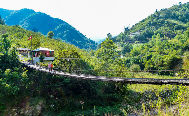 Opposite a bridge connecting a lonely village to the road