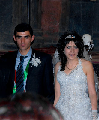 Bridal couples get married in the monastery Geghard