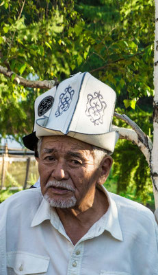 Kirgistan - man wearing an Ak-Kalpak (white cap)