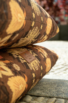 Cushy pouf designed by Luca Tornaghi for Etro Home, detail of layered cushions with patterned textile surface and soft thickness