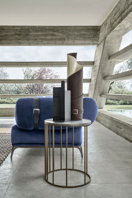 Coira vase designed by Luca Tornaghi for Gianfranco Ferré Home, combining wrapped leather surfaces, visible stitching and sartorial buckles within a compact architectural presence.