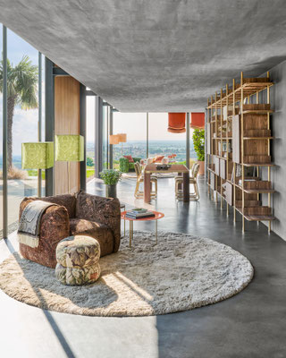 Cushy armchair designed by Luca Tornaghi for Etro Home, armchair and pouf in coordinated upholstered volumes