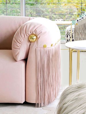 Malawi sofa by Luca Tornaghi for Roberto Cavalli Home, pink upholstered sofa with rounded forms and fringe detailing