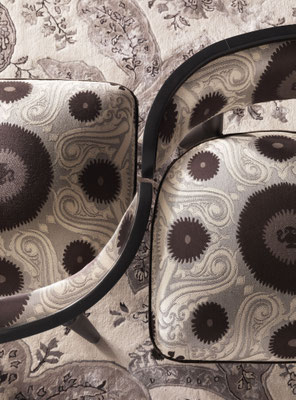 Shah armchair designed by Luca Tornaghi for Etro Home, close-up of the upholstered cushion highlighting the decorative textile as narrative surface