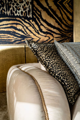 Kruger sofa by Luca Tornaghi for Roberto Cavalli Home, close-up of armrest with braided metal piping and smooth nubuck upholstery