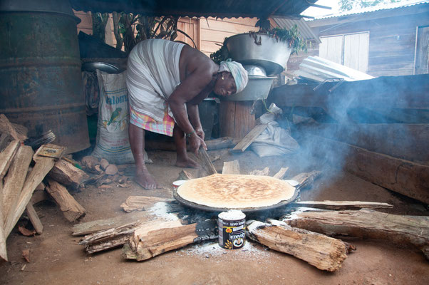 Saramaccan woman baking cassave bread (parakoranti) the traditional way