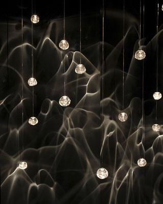 In front of a black wall