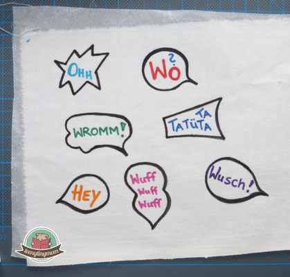 mit Textilmalstiften kleine Sprechblasen malen und mit schwarzem Rand versehen, Vlisofix aufbügeln