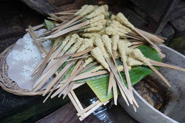 Traditional preparation of Balinese satay lilit, a local culinary favorite.