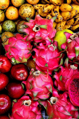 Fresh tropical fruits at a local market – pitahaya, banana, markisa