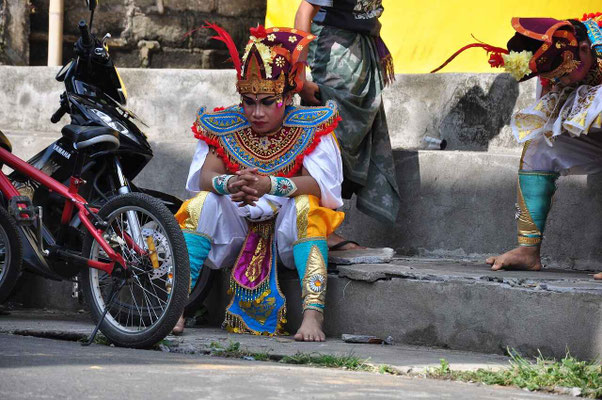 Balinese dancer waiting for his performance in dance costume
