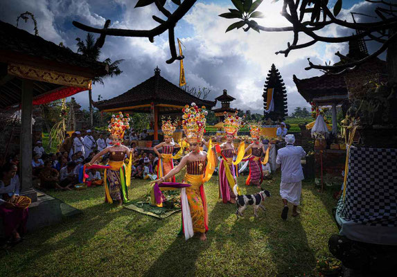 A graceful Pendet dance unfolding in front of a temple, rich with tradition.