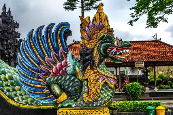 A colorful drake guarding the tranquil ponds of Tirta Gangga Water Palace.