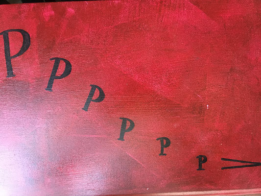 On the right of the resting cat is a series of p's, or pianissississimo...very, very, very soft. And the mark at the end is decrescendo, to get softer.