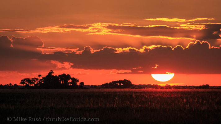 the sun sets over Kissimmee Prairie