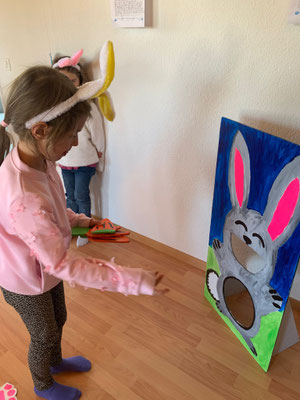 Child taking part in a fun Easter game at Custom Kids.