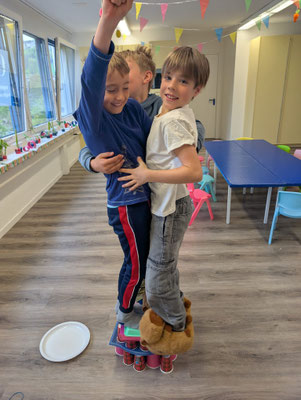 Custom Kids young engineers showing off their cup tower