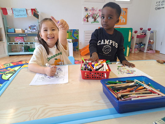 Children learning English through games and creative activities.