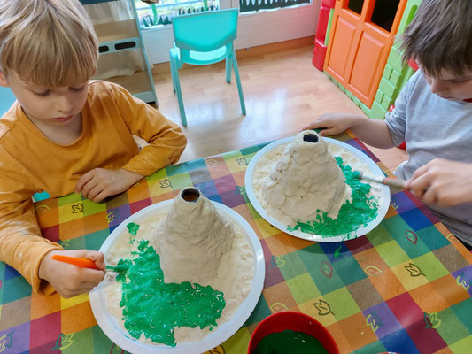 Exploring chemical reactions with volcano experiments at Custom Kids Science Club.