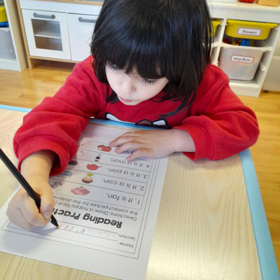 Reading and Writing practice at Custom Kids.