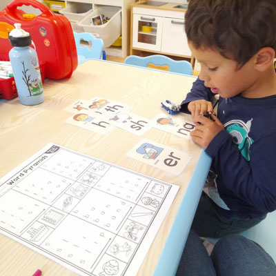 Phonics and Reading and Writing practice at Custom Kids.