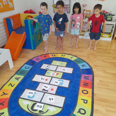 Children playing a sound recognition game at Custom Kids.