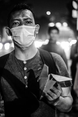 Worker with origami in the street of Jakarta