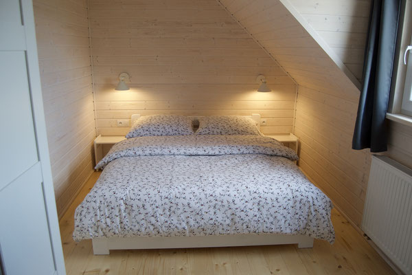 Schlafzimmer im Holzhaus