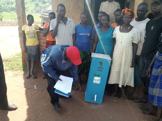 MMP Agro staff explaining how to use the water filters.