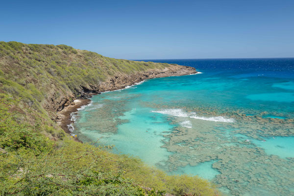 Hanauma Bay Nature Reserve, a marine embayment formed within a tuff ring when wave erosion cut through the low wall, forming the bay