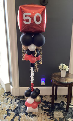 Air-filled balloon cloud red white black