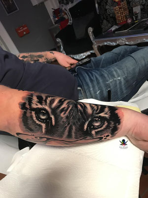 Tiger face tattoo
