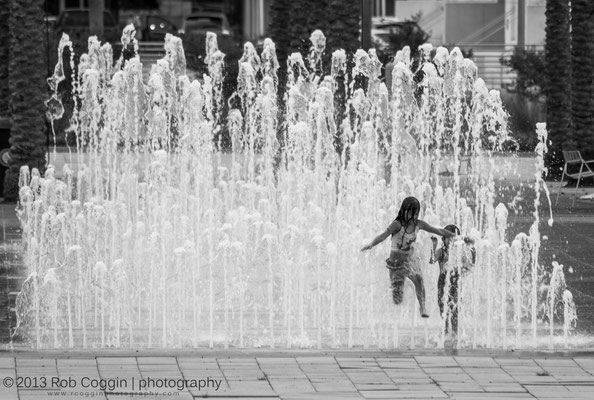 Kids playing in the water fountains, Tampa, FL