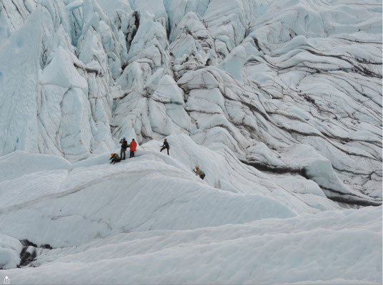 Cavers are lowered into the crevasses