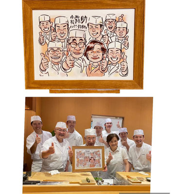 似顔絵受け取りの様子