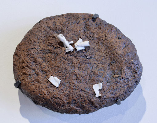 "Specimen 5"; 2018; ceramic, plastic bread tabs, iron mount; 8x10x5