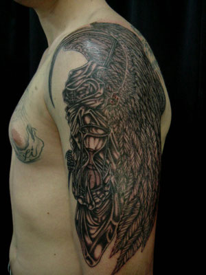 grim skull tattoo at genestar tattoo okinawa
