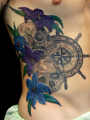 skull lily ship hand tattoo