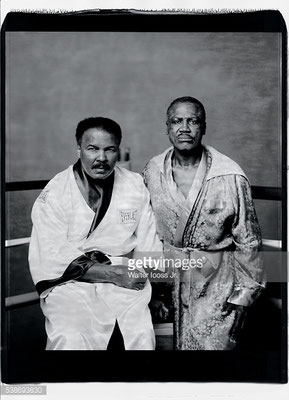First friends, then fierce rivals in the ring, Ali and Joe Frazier pose for a portrait in the boxing robes they wore the night of their first bout, at Frazier’s Gym in 2003. (Walter Iooss Jr/Sports Illustrated)