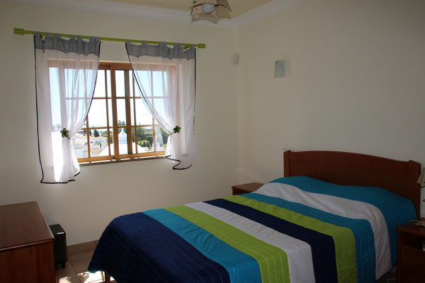 Bedroom Azul, upper floor. Window with sea view, bathroom en-suit.