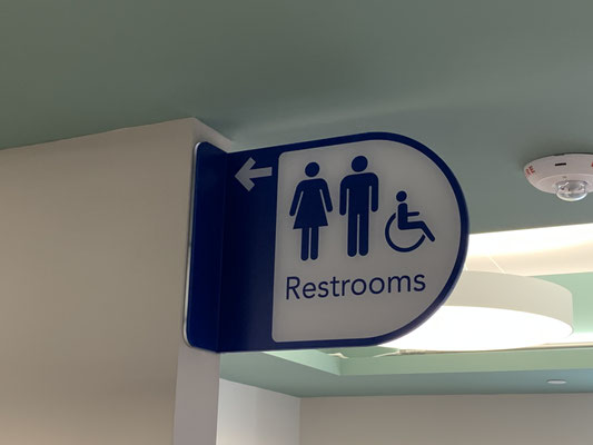 Restroom Directional Sign by Landmark Signs Inc.