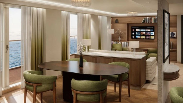 Crystal Grace Junior Penthouse Suite Wohnbereich mit Tisch, Stühlen Fernseher und Meerblick