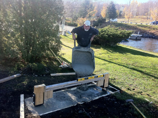 Mac pours concrete for the footer