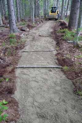 Gravel is brought in to fill the excavated tread