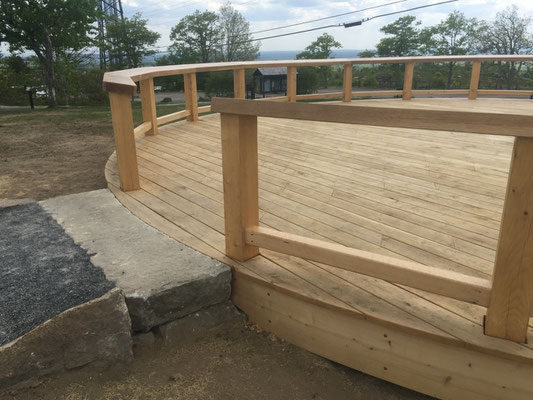 A piece of weathered granite was hand cut to fit the arc of the platform