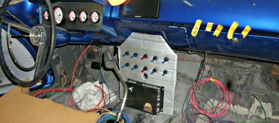 A cardboard mock-up holds the switches so the wiring can be checked before the final installation.