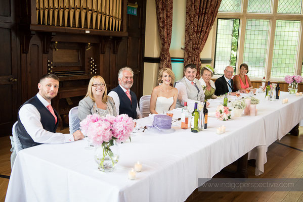 37-woolhanger-manor-wedding-photography-north-devon-top-table-smiles