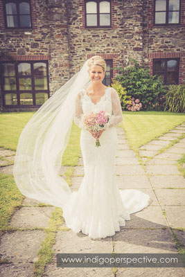 16-tipi-wedding-photography-north-devon-bride-flowers-veil-blowing-wind