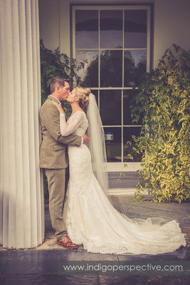 33-tipi-wedding-photography-north-devon-bride-groom-pillar-kiss-dress