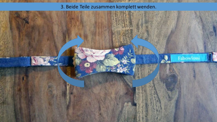 Schritt 3 der einfachen Anleitung zum Schleife binden - Beide Teile des Querbinders zusammen wenden.
